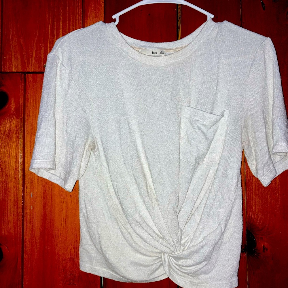 White blouse with scrunch design at bottom to make shirt high rise